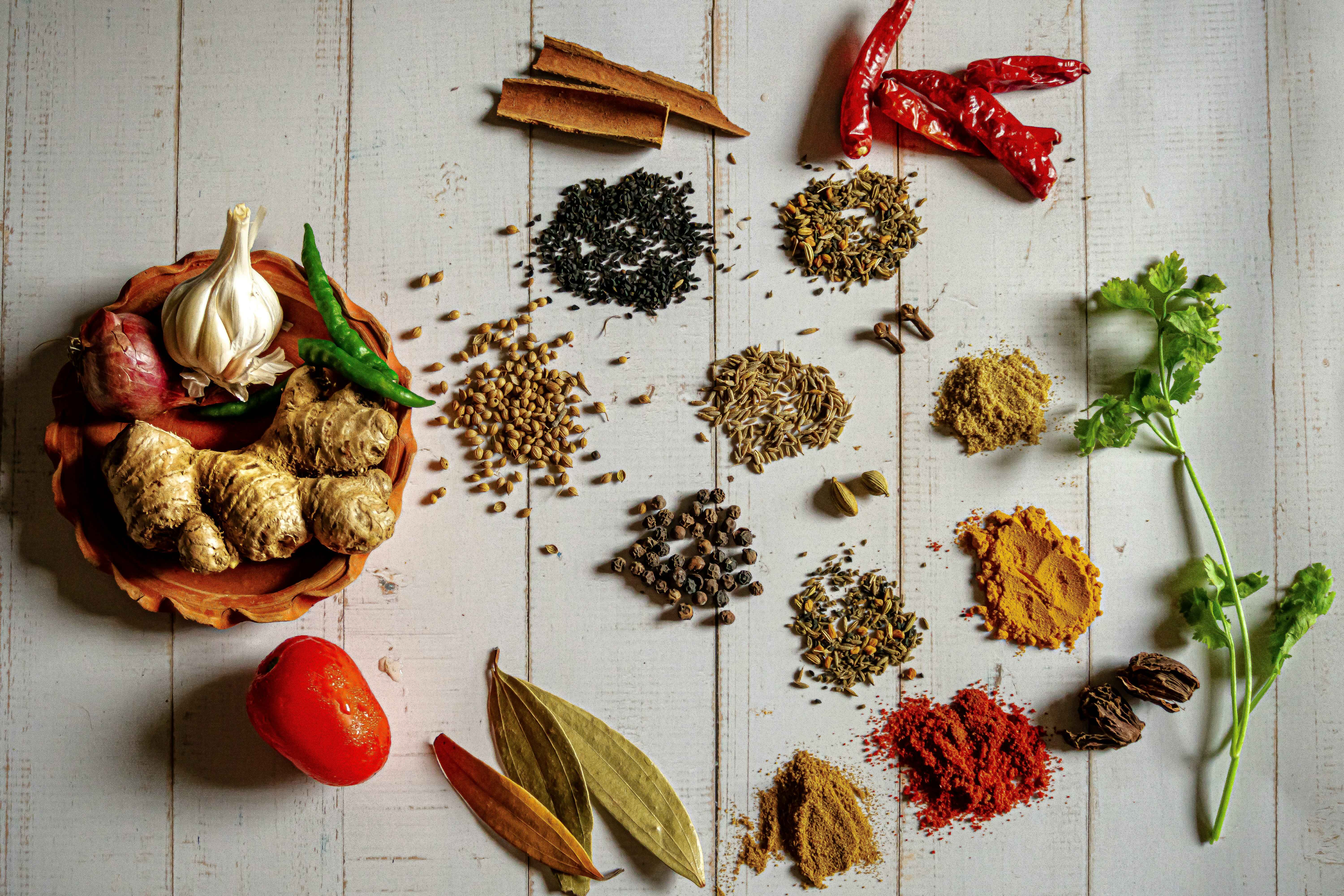 Spices, ginger for making biryani in a white background